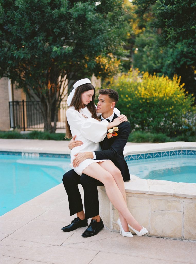 Couple Sits Poolside at a Courtyard Wedding at Sophie's Gasthaus